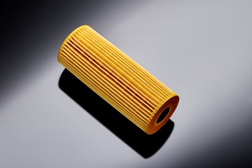 car engine oil filter on dark background