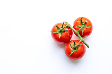 three tomatoes on a sprig