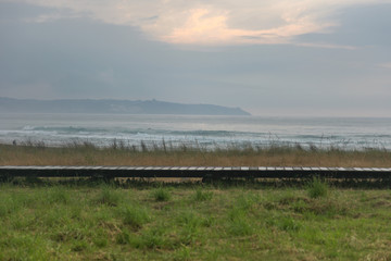 Sunset and fog at a surf bay in northern Spain