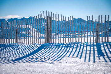 Andorra GrandValira Ski. Pyrenees Mountains. wooden fence in the mountains