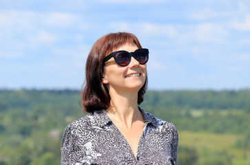 portrait of a woman by the river