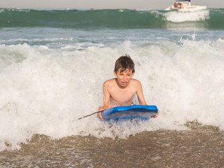 Child with body board