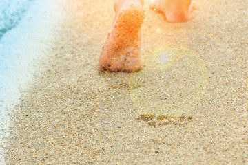 beautiful footprints in the sand by the sea background