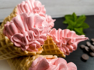 marshmallows in a cone with mint and strawberries