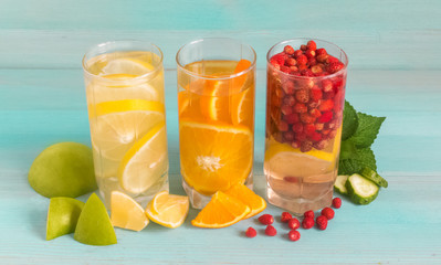 Summer refreshing cocktail of ripe fruit on a blue background