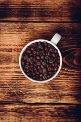 Roasted coffee beans in cup