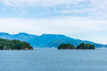 View over Inlet, ocean and island with mountains in beautiful British Columbia. Canada.