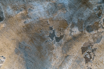 Stylized banner with space for text. Blue and yellow background texture decorative plaster. Grungy concrete wall with colorful lighting. Abstract grunge backplate with blurred edges.