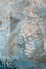 Old gray surface. Art rough stylized texture banner with space for text. Blue and yellow background texture decorative plaster. Grungy concrete wall with multi-colored lighting and blurred edges.