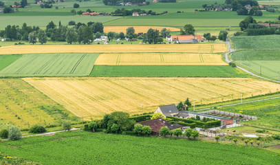 Diksmuide, Flanders, Belgium -  June 19, 2019: View on farms and farm land from up IJzertoren,...