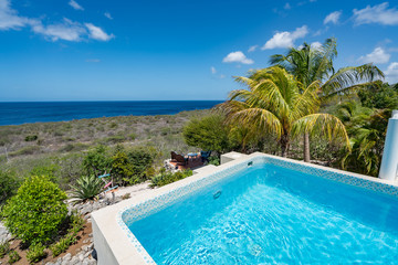 Drinks by a swimming poll on the Caribbean island of Curacao
