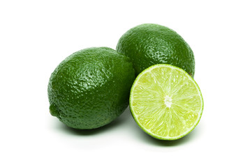 Lime, whole exotic tropical fruits with slice isolated on white background, healthy food, diet nutrition