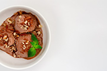 Chocolate ice cream with mint and nuts. A top view, and with an empty space for an inscription