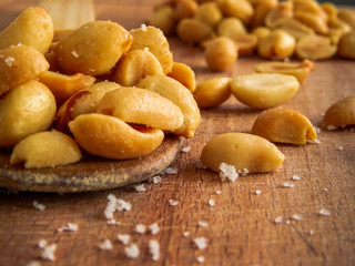 peanut on the wooden and blurry background salty close up