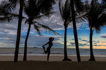 Fototapeta premium Athletic Woman Running on the Beach. Female Runner Jogging. Outdoor Workout.Healthy Concept