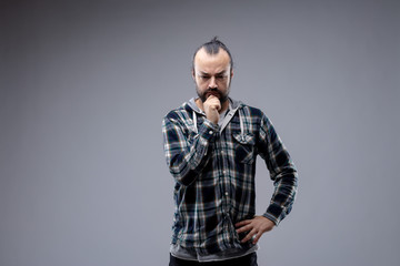 Thoughtful man with his hand to his chin