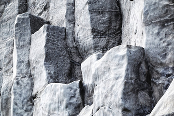 Natural stone texture. Basalt lava formations like columns. Icelandic typical natural background....