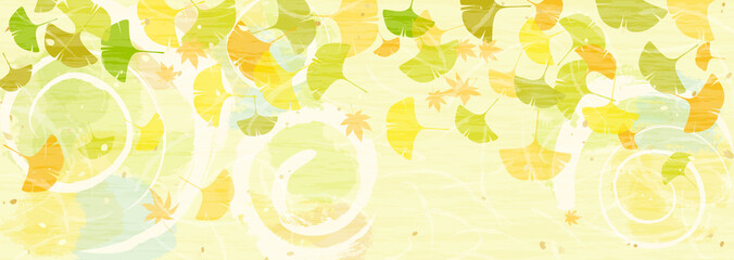 秋の陽だまりとカラフルな銀杏の葉