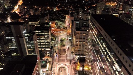 Aerial view of city at night with iluminated avenue. Great landscape.