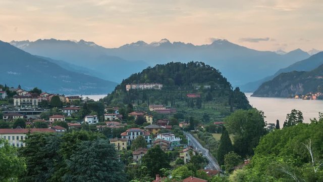 Time lapse Lake Como, outskirts of Bellagio city in alpine Lombardy region of northern Italy, beautiful mountain landscape on horizon, evening sky after sunset