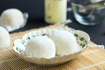 Japanese dessert mochi served in plate on bamboo mat