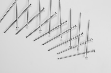 Metal nails isolated on white background. working tools