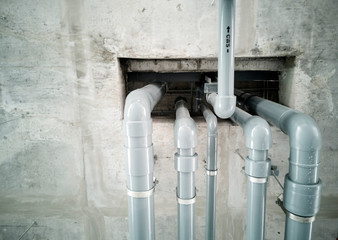 Sewer system installed on the ceiling and through the floor to the upper floor.