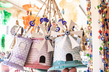 Naklejka premium They sell small windmill as a souvenir. The island of Cunda was