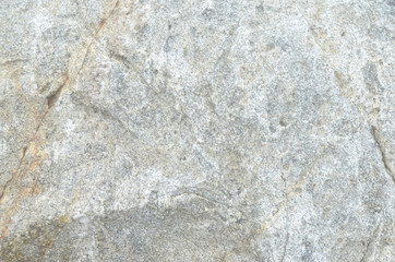 Granite rocks with faults, a background of old stones