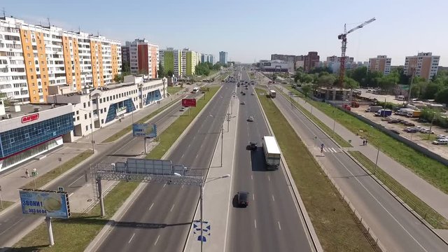 drone shooting of modern road in district of russian city in summer day