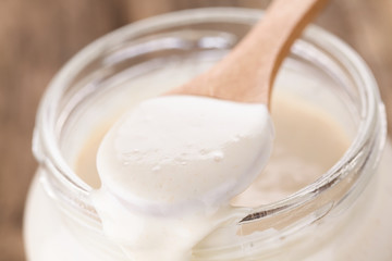 Fresh homemade bubbly sourdough starter, a fermented mixture of water and flour to use as leaven...