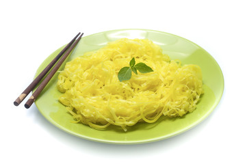 yellow noodles on dish isolated on white background