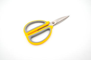 Yellow grey handle scissors isolate on white background. Paper, art, multipurpose cutting.