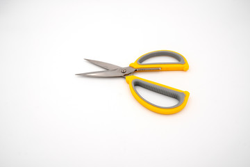 Yellow grey handle scissors isolate on white background. Paper, art, multipurpose cutting.