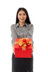 Happy smiling asian young lady holding beautiful red present box and isolated on white background. Portrait of business woman giving a gift.