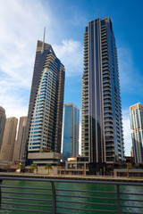 Fototapeta na wymiar High-rise houses of modern futuristic design of Dubai Marina district.