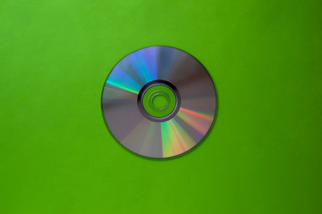 cd compact disc on a light green background top view with copy space 