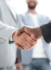 Business handshake. Two businessman shaking hands in office