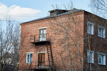 Facade of an old stone house in the Russian village