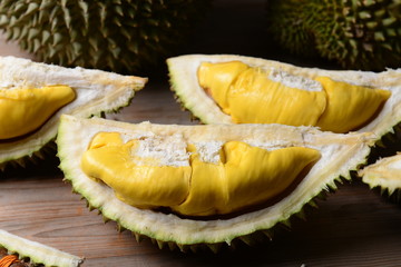 Durian riped and fresh ,durian peel with yellow colour on wooden table.