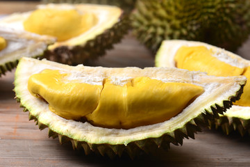 Durian riped and fresh ,durian peel with yellow colour on wooden table.