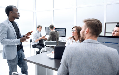 employee shares his ideas with the business team