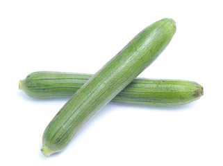 fresh green sponge gourd or luffa with slice isolated on white background