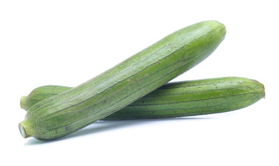 fresh green sponge gourd or luffa with slice isolated on white background