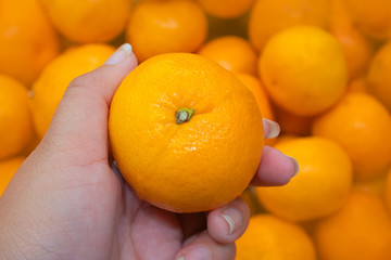 Closeup of orange In the market, the concept of vitamin C and health