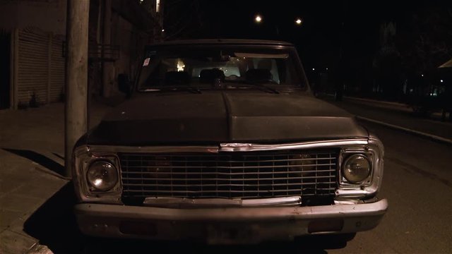 Old Vintage Car Parked at Night. 