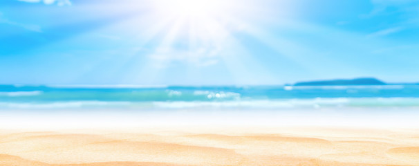 Fototapeta na wymiar Panorama view of blur beautiful tropical beach with bokeh sun light wave abstract background.