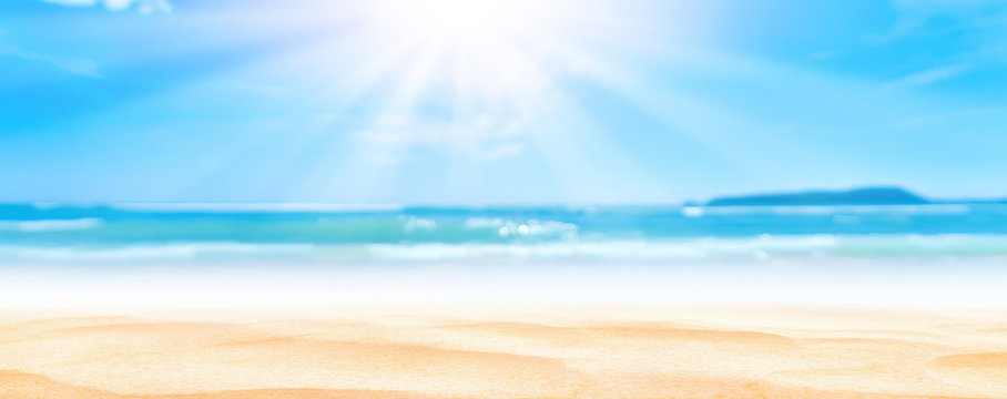 Panorama view of blur beautiful tropical beach with bokeh sun light wave abstract background.