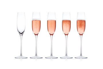 Rose pink champagne glass with bubbles isolated