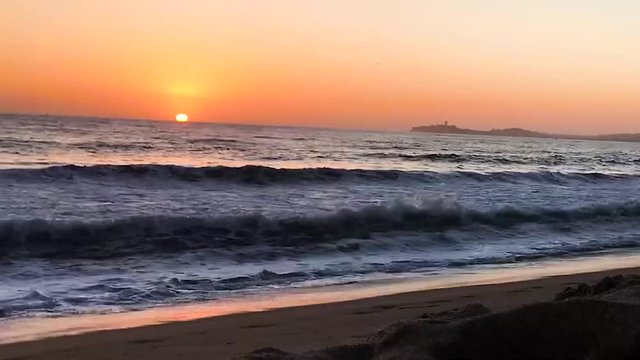 Peaceful and colorful evening colors with sunset time lapse at half moon bay beach by the pacific ocean